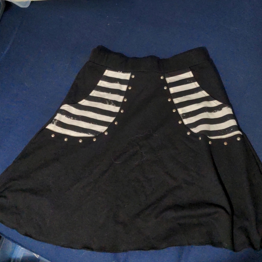 Folter knee length skirt, black with striped pockets, size medium